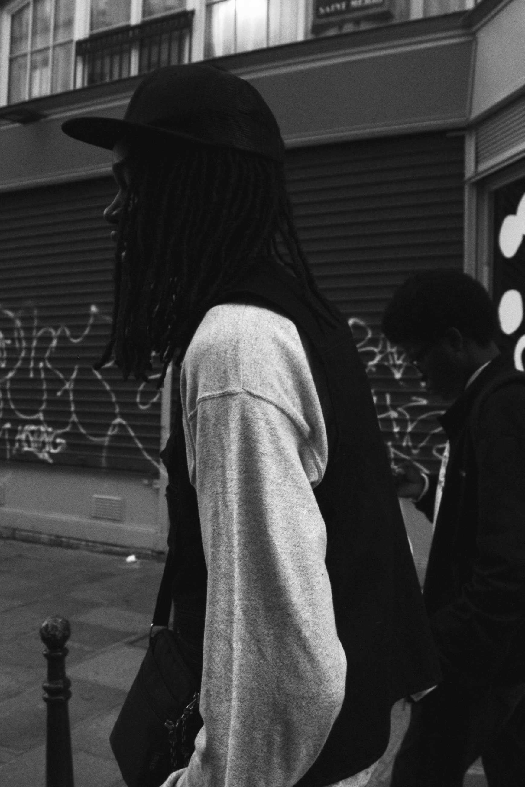 photo of two men walking on the streets of Paris